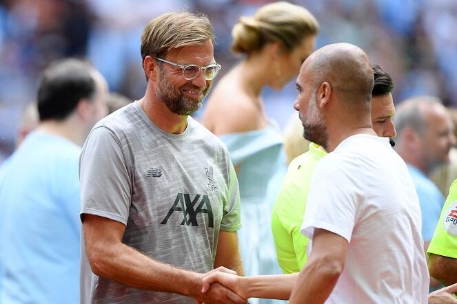 Liverpool manager Jurgen Klopp and Manchester City manager Pep Guardiola shake hands